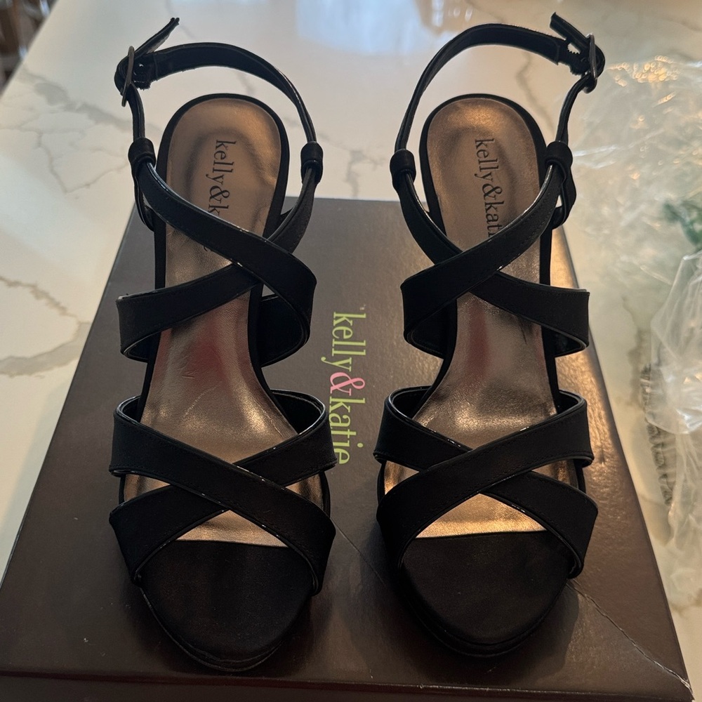 Brand New Never worn in box Kelly & Katie Black Heel. Size 7. Beautiful shoe!